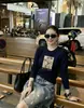 Camiseta de Algodón Acanalado de Manga Larga para Mujer, Top Ajustado Guangzhou Shisanxing, Segunda Entrega Exclusivamente para Camiseta Base de Cuello Redondo, Venta Directa