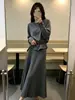 Elegante Conjunto de Suéter 2026 Otoño/Invierno Nuevo Conjunto de Dos Piezas con Top de Punto Irregular y Falda Plisada para Mujer