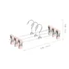 Colgador de pantalones de hierro recubierto de plástico con pinzas, colgador de pantalones retráctil de acero inoxidable, antideslizante, apto para uso doméstico, comercial, hoteles, dormitorios, colgador de pantalones sin taladro