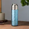Nueva taza térmica de titanio puro de alta gama con separador de té, patrón de martillo, alto valor de color, taza portátil para té y guisos para exteriores, venta al por mayor