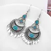 Pendientes largos bohemios de turquesa con borlas de gota de agua Pendientes clásicos de estilo real con tallado hueco
