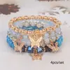 El más vendido en Europa y América: Pulsera con colgante de mariposa estilo bohemio, pulsera multicapa creativa de cordón elástico con cuentas