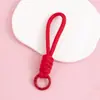 Llavero cordón de cuerda trenzada de nailon para hombres y mujeres hebilla de montañismo cuerda de mano para parejas colgante de bolsa teléfono llave lazo