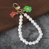 Nuevo colgante de llavero de coche de perlas, lindo accesorio para fundas de auriculares, decoración de bolso, accesorio de cadena colgante para equipaje para mujeres