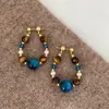 Nostalgia de Arce Estilo Chino Nuevo Pendientes de Ojo de Tigre con Perlas Azules para Mujer Pendientes Retro Bohemios de Vacaciones
