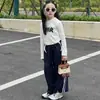 Nuevo bolso de mano de dibujos animados con cara sonriente para otoño e invierno, un mini bolso Kelly de alta gama con bloques de color, un bolso pequeño elegante y versátil para padres e hijos
