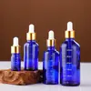 Botellas de vidrio al por mayor de 50 ml para aceites esenciales con gotero graduado, botellas de muestra cosméticas a prueba de luz, botellas de vidrio vacías