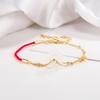 Pulsera de cuerda roja con hebilla de jade Benmingnian 2022, pulsera de jade con incrustaciones de dinero, lujo ligero, estilo retro de alta gama.