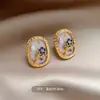 Nuevos Pendientes de Botón con Flor de Esmalte y Circonita de Moda Estilo Chino de Lujo Ligero con un Diseño de Pétalo Vintage de Nicho de Gama Alta