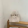 Bolso de mano tejido de estilo coreano de alta moda para mujer, otoño temprano 2026, bolso tote pequeño, bolso de hombro tipo cubo elegante y simple