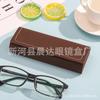 Estuche para gafas de estudiante para hombres y mujeres, simple, portátil, de cuero de alta calidad, retro, fresco, antipresión, caja de almacenamiento para gafas.