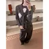¡Artículos de calidad de Guangzhou Shisanhang! Suéter tejido de estilo retro para mujer Otoño 2026