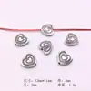 Acessórios de joias de liga DIY transfronteiriços 100 por pacote de contas soltas com contas material para pulseira colar Contas em formato de coração de prata Xizang