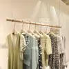 Tienda de ropa barra colgante de madera maciza perchero para colgar ropa estante de exhibición tienda de ropa para niños tienda de ropa para mujeres estante rama seca techo barra de madera