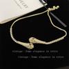 Pulsera de moda de lujo ligero dorada con doble serpiente extraíble con diamantes flash para Niñas Pulsera de temperamento de personalidad nicho de alto sentido que combina con todo