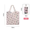 Bolsa de compra portátil de poliéster, grande, de tela floral 190T, disponible en stock. Bolsa plegable al por mayor. Bolsa de regalo publicitaria.