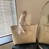 Bolso tote de alta gama transfronterizo para mujer, bolso de hombro de estilo nuevo y simple, bolso de axila versátil de gran capacidad para el trabajo, bolso de mano