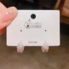 Pendientes de aro de trébol de cuatro hojas con circonita estilo vintage, pendientes dulces de lujo ligero de alta gama populares para mujer
