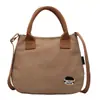 Bolsa Casual de Grande Capacidade para Mulheres Primavera 2026 Simples Leve Versátil Bolsa de Ombro Bolsa Tote Escolar Armazenamento de Mão