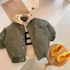 Chaqueta acolchada para niño ropa de invierno 2026 nueva ropa para niños abrigo de algodón engrosado para bebé chaqueta tipo béisbol de un solo botón para niño pequeño