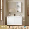 Tocador de baño engrosado y ahorrador de espacio con diseño en color crema, que cuenta con un lavabo redondeado, lavabo cerámico integrado y un lavabo de una sola pieza.