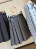 Falda plisada de lana gris estilo colegial para mujer, nuevo estilo otoño 2026, cintura alta, corte ajustado, anti-exposición, falda línea A