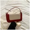 A bolsa de compras retrô popular deste ano é uma bolsa pequena quadrada color block patchwork estilo coreano para mulheres, apresentando um design artístico e simples, adequada para usar no ombro ou transversal.