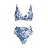 Nuevo traje de baño estilo europeo y americano, traje de baño de una pieza floral azul para vacaciones, popular atuendo de playa transfronterizo 29466