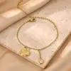 Tobillera con Colgante de Flor Cadena de Acero Inoxidable Chapada en Oro de 18 Quilates Joyería de Circonita Estilo Festivo de Venta Caliente Transfronteriza Europea y Americana Joyería para el Pie