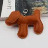 Colgante de bolso de peluche de cachorro en stock del fabricante, accesorio de llavero creativo y moderno de cuero PU para coche de cachorro, decoración para teléfono