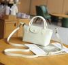 Bolsa Transversal de Couro de Vaca de Primeira Camada Nova Europeia e Americana para Compras e Deslocamento Versátil Fashionável Macia de Ombro Feminina Prática