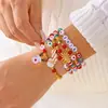 Set de Pulseras Navideñas Multicapa Transfronterizas Europeas y Americanas Personalizado Colorido Arcilla Suave Cristal Cuerda Elástica Pulsera Festiva