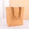 Bolsa de papel Dupont con logo personalizado, bolsa de lona vintage, bolsa de hombro de papel kraft lavable para compras, en stock