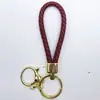 Venta al por mayor del fabricante Llavero de Cuerda de Aleación Tejida y Cuero Accesorios Colgantes Material PU Bolsas Pequeñas de Regalo Accesorios para Llaveros