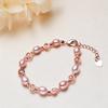 Joyería al por mayor Artículos pequeños Joyería de mano Suministro de puesto de perlas en forma de arroz de Zhuji Pulsera de perlas de agua dulce genuinas de moda Ol para mujer