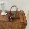 2026 Nova Moda Bolsa Transversal Simples Feminina Estilosa Estilo Coreano Bolsa de Ombro Único Design de Nicho para o Dia a Dia Bolsa Bolinho