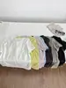 Camiseta de Color Sólido con Cuello Redondo y Manga Corta de Tencel + Lino con Costura Trasera, Estilo Nuevo, Fresca y con Caída, Top Holgado y Versátil