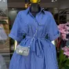 Moda Feminina Transfronteiriça Europeia e Americana Primavera 2026 Novo Vestido Camisa Azul Estiloso com Lapela, Botões Frontais Únicos e Cintura com Amarração