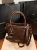 Bolsas Texturizadas de Moda Transfronterizas 2025 Invierno Nuevo Estilo Retro Bolso de Hombro Cruzado Moda Bolso Bandolera Tipo Cubo para Mujeres