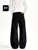 Pantalones casuales de pierna ancha, diseño dividido deconstruido, corte holgado y limpio, en rico estilo callejero americano, mezclilla negra para hombres y mujeres