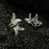 Clipe de orelha borboleta com padrão de grama Tang vazado, outono e primavera, novo nicho, moda nacional, vento doce e cool, clipe de osso de orelha borboleta voadora de camada dupla sem furos