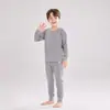 Conjunto de Pijama Redondo para Niños Dos Piezas Estilo Otoño/Invierno Unisex Suave Pegajoso Agradable a la Piel Color Sólido Versátil Cálido Conjunto para Estar en Casa