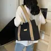 2025 Bolsa de Lona Versátil para Viajes Estudiante Femenina Bolso de Hombro para Clase Bolso Tote Bolso Tote Estilo Nuevo