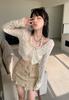 Camisa de malla dulce y picante de estilo americano, cárdigan exterior de verano para mujer, top fino de manga larga y corte entallado de estilo puro