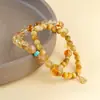 Joyería Jingde: Pulsera de citrino amarillo natural de alta transparencia con tres o más capas, combinada con un dije o colgante, una pulsera de cristal que se cree que trae buena fortuna