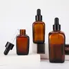 En stock al por mayor botella cuadrada de vidrio ámbar oscuro para aceite esencial de té botella con gotero de aceite esencial botella marrón para esencia