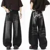 Jeans retro americanos negros de bajo curvo para hombre y mujer, nuevo estilo de primavera, diseño de alta costura, corte holgado, adelgazante, pierna ancha con caída.