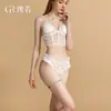 Conjunto de Lencería Sexy DZ Guiruo 7239: Bordado de Malla Transparente con Adornos de Moño y Conjunto de Lencería Calado (Bragas y Top)