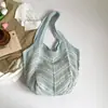 Bolso de Hombro Individual Calado Tejido para Mujer Primavera 2026 Nuevo Bolso Tejido Rayado Casual de Gran Capacidad para Vacaciones en la Playa Estilo Simple