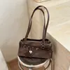 Bolsa de ombro estilo garota hot retrô Shuai Mi Jia para mulheres, nova bolsa de mão para o dia a dia 2026, bolsa baguette, bolsa de ombro texturizada